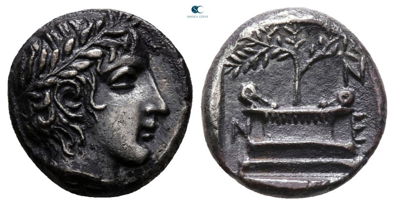 Troas. Neandria circa 400-300 BC. 
Triobol AR

13 mm, 1,89 g

Laureate head...
