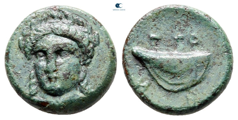 Aiolis. Gryneion circa 350-250 BC. 
Bronze Æ

12 mm, 1,56 g

Head of Apollo...