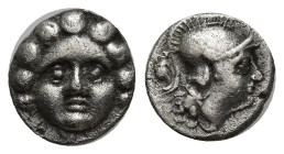 Pisidia, Selge AR Obol. (10mm, 0.91 g) Circa 350-300 BC. Gorgoneion / Helmeted head of Athena right; astragalos behind.