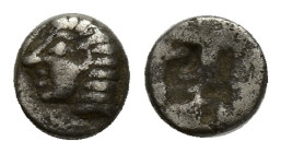 IONIA. Kolophon. (Late 6th century BC). AR Tetartemorion. (5mm, 0.21 g) Obv: Archaic head of Apollo left. Rev: Quadripartite incuse square.