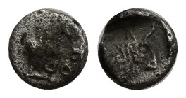 Caria, AR Tetartemorion. (5mm, 0.24 g) Uncertain mint, c. 5th C. BC. Confronted foreparts of two bulls / Forepart of a bull r., in incuse square.