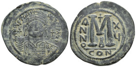 Justinian I. 527-565. Æ Follis (39mm, 23.00 g). Constantinople mint, 4th officina. Dated RY 15 (541/2). Helmeted and cuirassed bust facing, holding gl...