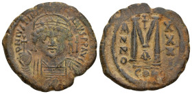 Justinian I. AD 527-565. Dated RY 32=AD 558-559. Constantinople Follis Æ (29mm, 12.81 g). D N IVSTINIANVS P P AVG, helmeted, draped and cuirassed bust...