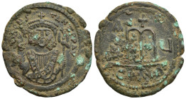 TIBERIUS II CONSTANTINE, 578-582 Follis, Constantinople, 579. AE (37mm, 17.74 g). D m TIb CONS-TANT P P AVC Consular bust facing, wearing consular man...