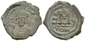 Maurice Tiberius. 582-602. Æ follis (28mm, 11.25 g). Constantinople, Helmeted and cuirassed bust of Maurice Tiberius facing, holding globus cruciger a...