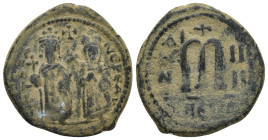 Phocas. 602-610. Æ follis. (26mm, 10.96 g) Theoupolis (Antioch) Mint. Phocas and Leontia standing facing; Phocas holding globus cruciger, Leontia hold...