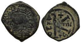MAURICE TIBERIUS. 582-602. Æ 1/2 Follis. (19mm, 4.86 g) Thessalonica mint. Dated RY 4 (586/7). Obv: Helmeted facing bust, holding globus cruciger. Rev...