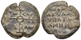 Byzantine Lead Seal Obv: Cruciform monogram Rev: Legends in four lines, ornament above and below. 27mm, 15.14 gr.