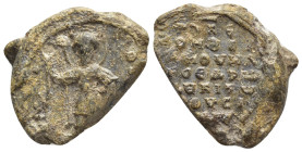 Byzantine Lead Seal Obv: Saint nimbate, standing facing, holding spear in his right hand and shield in his left. Rev: Legends. 22mm, 14.50 gr.