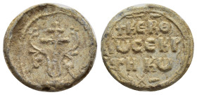 Byzantine lead seal, Large patriarchal cross on steps, with floral ornaments springing from the base. Rev: Legends in four lines. 19mm, 8.10 gr.