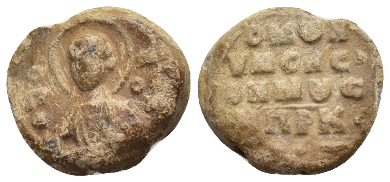 Byzantine lead seal, Obv: Bust of saint facing, nimbate / Rev: Legends in four l...