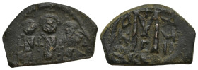 Arab-Byzantine, Umayyad Caliphate Æ Fals. (25mm, 5.46 g) "Pseudo-Byzantine" mint, circa AD 650-674. Three standing figures, each holding globus crucig...