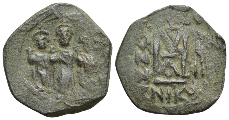 ARAB-BYZANTINE: Rashidun Caliphate, AE fals, (26mm, 6.97 g)Three standing figure...