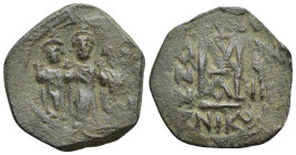 ARAB-BYZANTINE: Rashidun Caliphate, AE fals, (26mm, 6.97 g)Three standing figures c. 637-643. Imitating a follis of Nicomedia, uncertain mint in Syria...