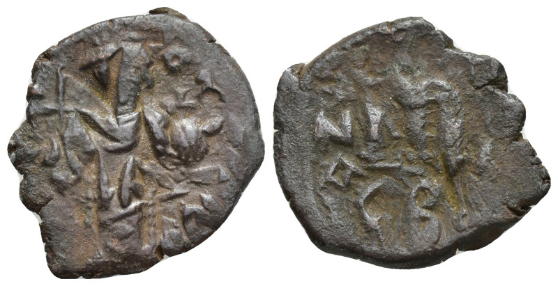 Arab-Byzantine, c. 660s-680s. Æ Fals (21mm, 5.20 g), Emperor standing facing, ho...