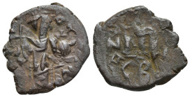 Arab-Byzantine, c. 660s-680s. Æ Fals (21mm, 5.20 g), Emperor standing facing, holding long cross and globus cruciger. R/ Cursive M; ANA to l.; CB belo...