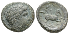 KINGS OF MACEDONIA, Philip II. Be17. (Ae. 5,9 g. /18,7 mm). 359-336 BC (Seaby 6698) Obv: Diademed head of Apollo right. Rev: Philip II on horseback ad...