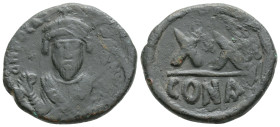 Phocas (602-610). AE Half Follis. Constantinople mint, 603-610 AD. Obv. Crowned bust facing, wearing consular robes, holding mappa and cross. Rev. Lar...