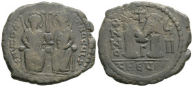 Byzantine Coins (565-578). 13,9 g. 33,9 mm. AE Follis, Theoupolis (Antioch) mint. Obv. Blundered legend. seated facing on double throne; between their...