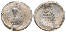 BYZANTINE LEAD SEAL. 6,1 g. 23,9 mm.
Obv: Nimbate bust of Saint. Rev: Legend in Four lines.
