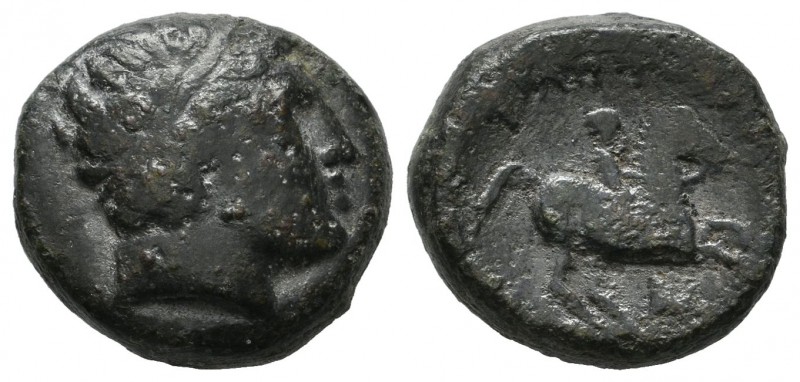 Kings of Macedon. Philip II. 359-336 BC. AE (15mm, 6.30g). Laureate head of Apol...