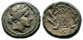 Mysia, Kyzikos. Circa 2nd century BC. AE (17mm, 5.95g). Head of Kore Soteira right, wearing wreath of grain. / KY - ΞI and ATP or ΔΡI monogram within ...