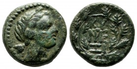 Mysia, Kyzikos. Circa 2nd-1st century BC. AE (16mm, 5.17g). Head of Kore Soteira right, wearing wreath of grain. / KY - ΞI and Monogram; all within wr...