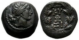 Mysia, Kyzikos. Circa 2nd-1st century BC. AE (17mm, 5.38g). Head of Kore Soteira right, wearing wreath of grain. / KY - ΞI and monogram within an oak-...
