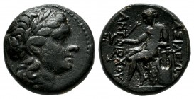 Seleukid Kingdom. Antiochos II Theos. 261-246 BC. AE (15mm, 4.19g). Head of Apollo right / ΒΑΣΙΛΕΩΣ/ ANTIOXOY. Apollo seated left on omphalos, left ar...