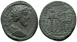 Ionia, Ephesos homonoia with Lydia, Tralleis. Marcus Aurelius, AD.161-180. AE (36mm, 26.25g). AY KAI ANTΩNEINOC. Lauretae draped and cuirassed bust ri...