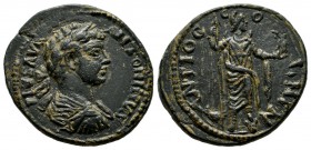 Pisidia, Antiochia. Elagabalus, AD.218-222. AE (23mm, 6.49g). ANTONINVS IMP PIVS AVG, Laureate, draped, and cuirassed bust right / Mên standing right,...