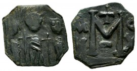 Heraclius with Heraclius Constantine, and Martina, 610-641 AD. AE Follis - 40 Nummi (16mm, 1.97g). Uncertain mint in Cyprus. Heraclius, in center, fla...
