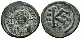 Justinian I. 527-565 AD. AE Half Follis (26mm, 9.94g). Cyzicus mint. Dated RY 17 (543/4). Helmeted and cuirassed bust facing, holding globus cruciger ...