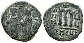 Phocas, AD.602-610. AE Follis (26mm, 8.97g). Antioch, Dated year 7 (608/9 AD). D N FOCA NE PE AV. Phocas and Leontia standing facing with globus cruci...