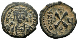 Tiberius II Constantine, AD.578-582. AE (18mm, 3.68g) Decanummium. Antioch mint. Scarce. Illegible legend, crowned and cuirassed bust facing, holding ...