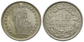 Switzerland, 1964 Silver 1 Franc, KM #24 | Designer: Albert Walch. Standing Helvetia with lance and shield within star border; HELVETIA below. 1 Fr. 1...