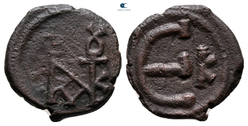 Justin II AD 565-578. Constantinople
Pentanummium Æ

14 mm, 1,53 g



ver...