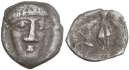 Greek Italy. Central and Southern Campania, Phistelia. AR Obol, c. 325-275 BC. Obv. Male head facing slightly right. Rev. Dolphin, grain of barley and...
