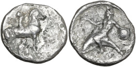 Greek Italy. Southern Apulia, Tarentum. AR Nomos, c. 340-335 BC. Obv. Nude ephebos on horseback right, crowning the horse; nude youth below removing s...