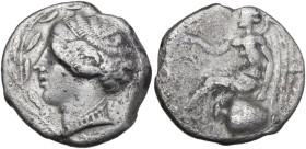 Greek Italy. Bruttium, Terina. AR Nomos, c. 440-425 BC. Obv. Female head left, within olive-wreath. Rev. Nike seated left on hydria, holding wreath in...