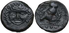 Sicily. Kamarina. AE Tetras, c. 420-405 BC. Obv. Gorgoneion facing. Rev. Owl standing right, head facing, grasping lizard; three pellets in exergue. H...