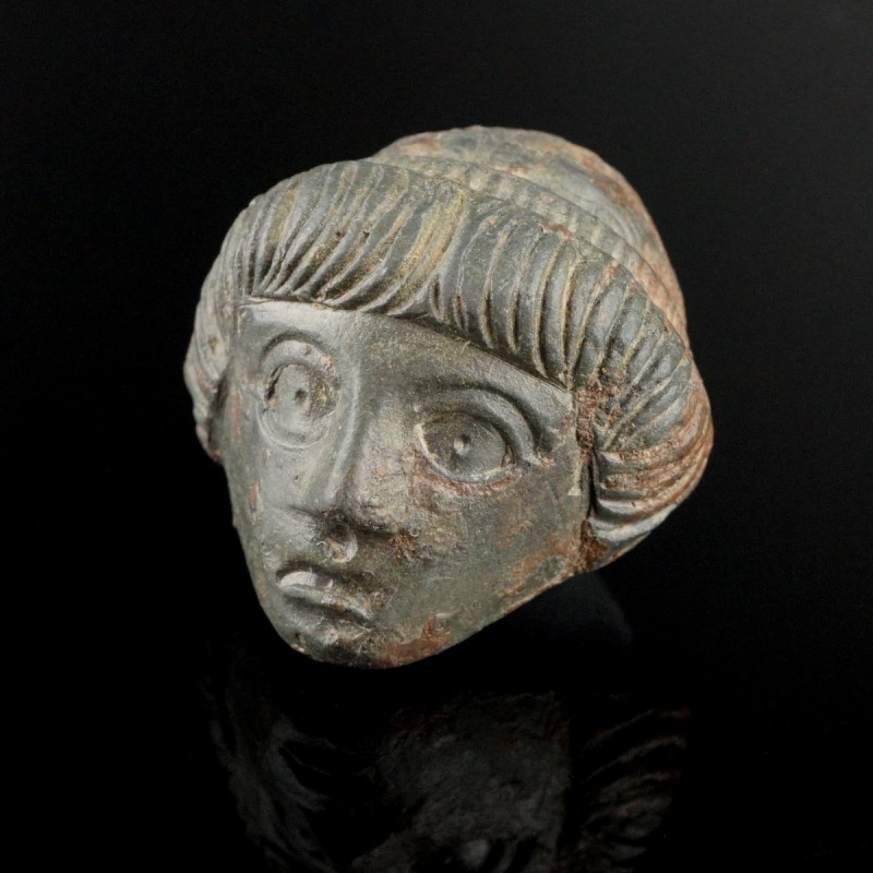 Roman Female Head
1st-3rd century CE
Bronze, 24 mm
Expressional young face.
...