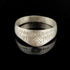 Roman Silver Ring
1st-3rd century CE
Silver, 16 mm; 15 mm internal dm
Intact and wearable. Engraved with fine lines.
Excellent condition. 
Ex. Co...