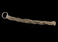 Roman/Byzantine Braided Silver Wire 
2nd-10th century CE
Silver, 71 mm, 1,77 g
Silver wire soldered on a small plate and a loop.
Very fine conditi...
