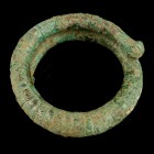Greek Spiral Bracelet/Ring
8th-4th century BCE
Bronze, 49 mm
Intact. Richly decorated by fine lines. 
Very fine conditon. 
Ex. Coll. B.K., acquir...