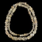 Roman Berg-Crystal/Quarz Necklace
1st-3rd century CE
Berg-Crystal, Quarz, 76 cm
Intact and wearable. Ancient beads of different shape. Threaded on ...