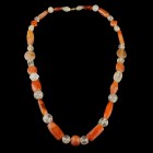 Roman Carnelian/Quarz Necklace
1st-3rd century CE
Carnelian, Quarz, 64 cm
Intact and wearable. Ancient beads of different shape. Threaded on a mode...