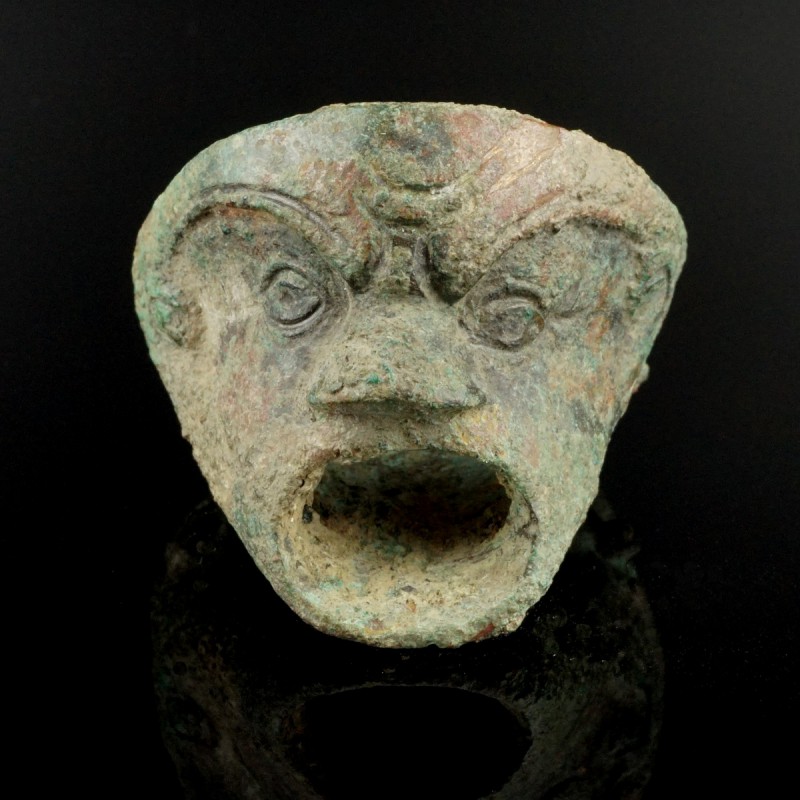 Roman Bronze Mask
1st-3rd century CE
Bronze, 39 mm
Intact. Mount formed as a ...