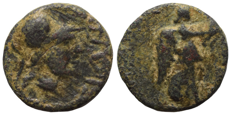 Greek. Ae (bronze, 1.48 g, 13 mm). Helmeted head of Athena right. Rev. Nike/Vict...