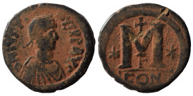 Justin I, 518-527. Follis (bronze, 16.75 g, 30 mm), Constantinople. DN IVSTINVS PP AV Diademed, draped, and cuirassed bust right. Rev. Large M; cross ...